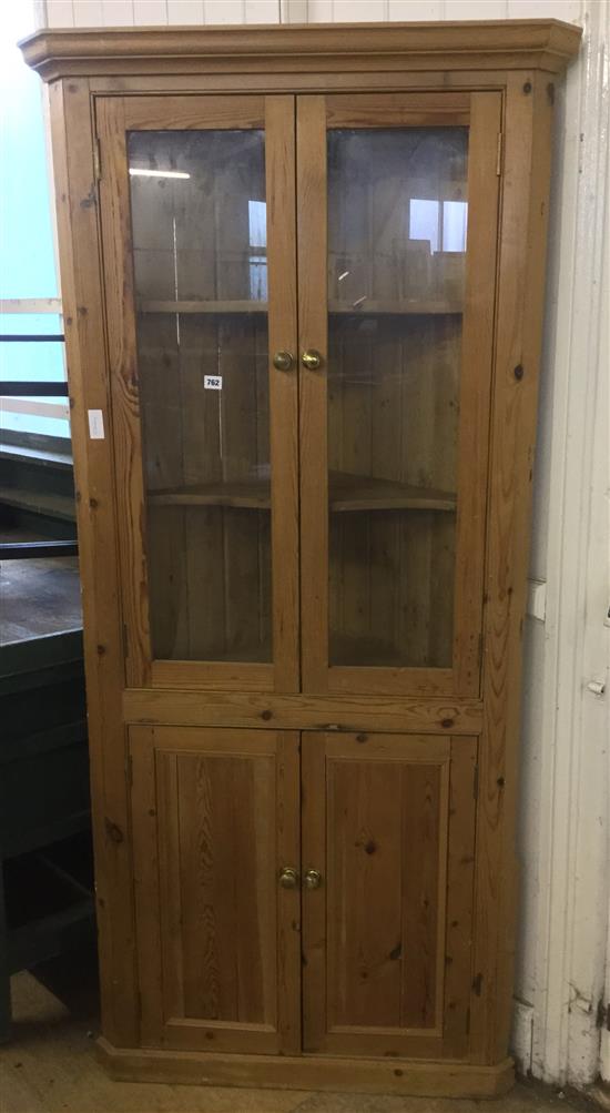 Glazed pine standing corner cabinet